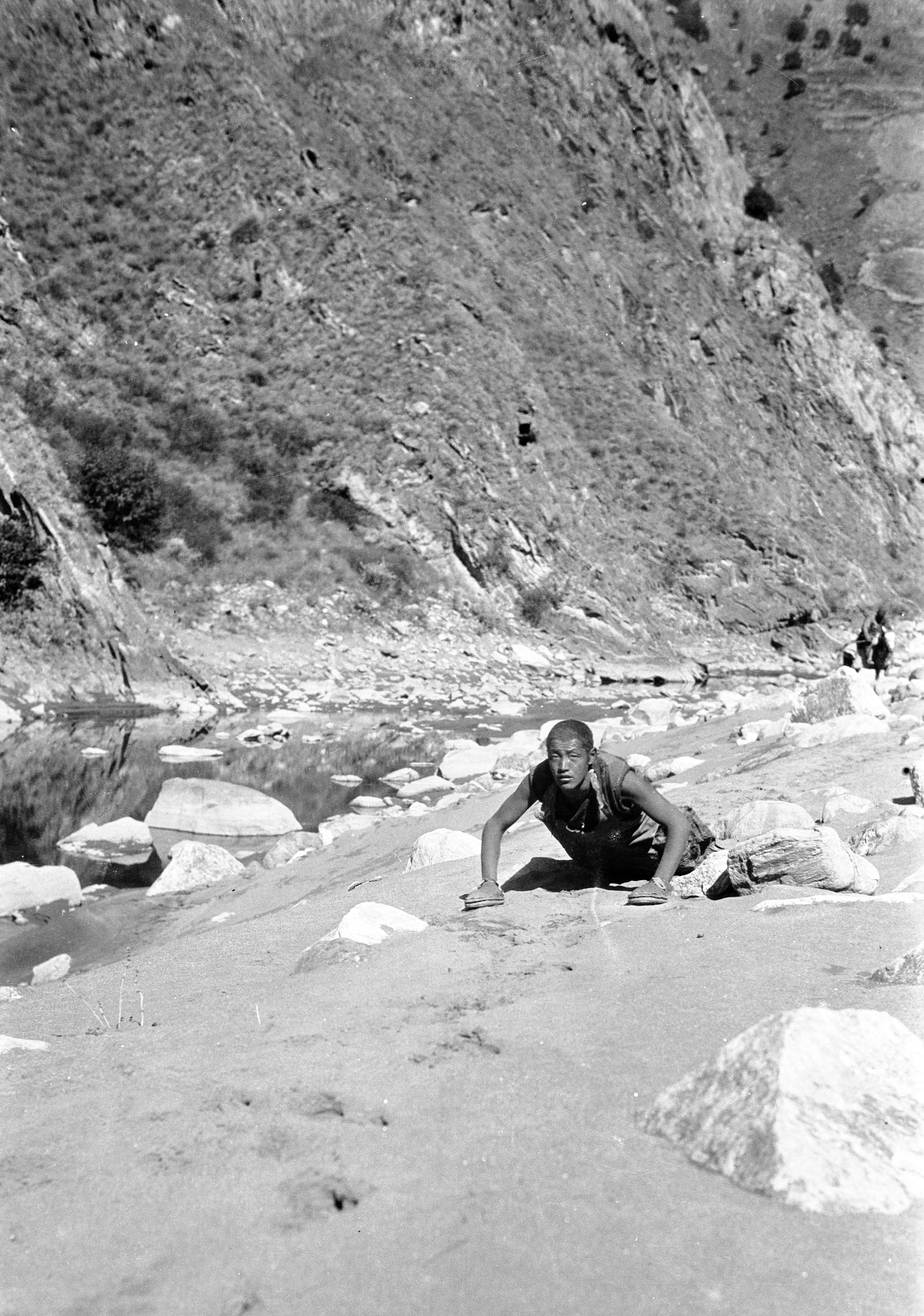 Picture of A Lama on a full prostration pilgrimage on his hands and knees