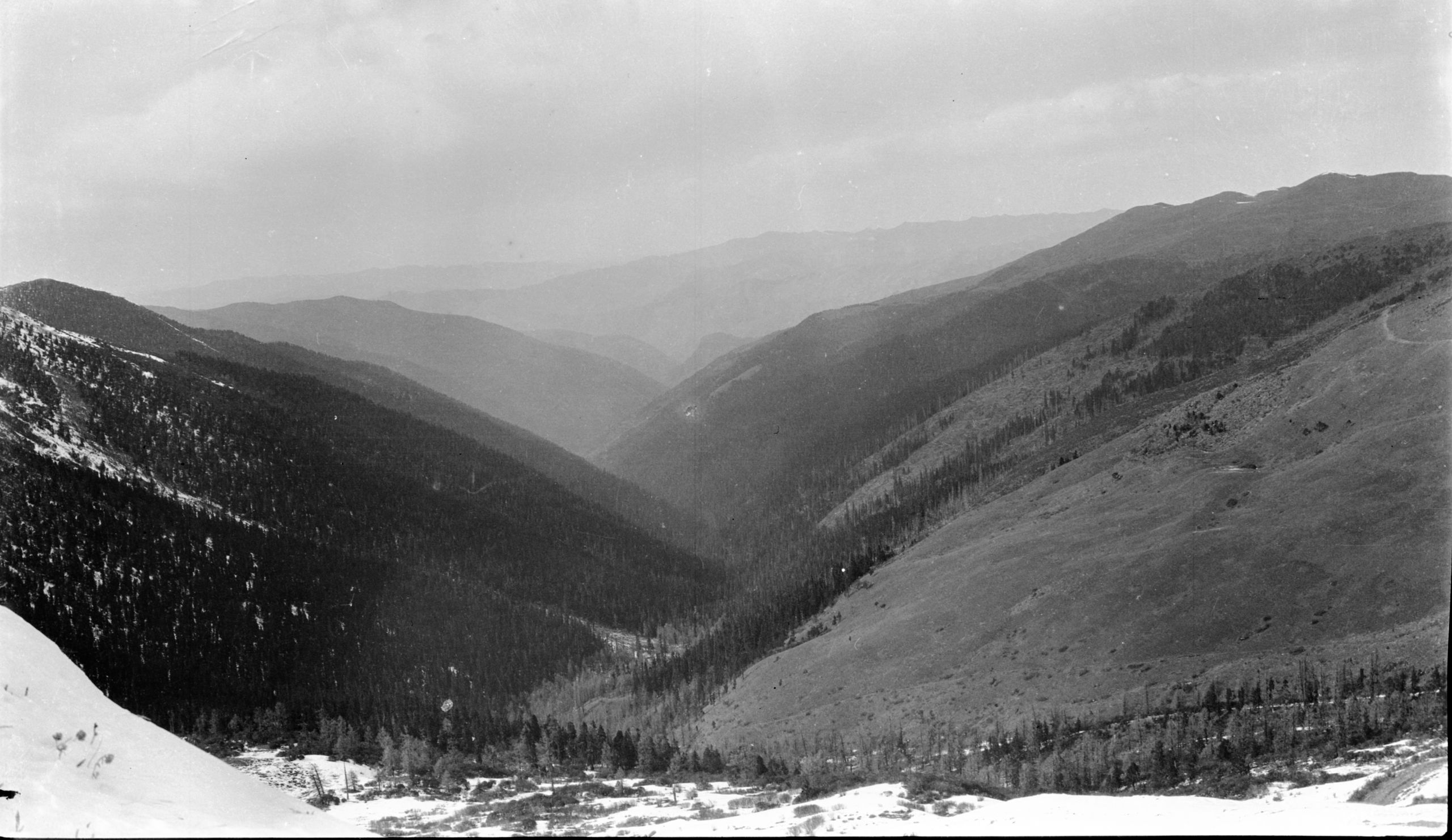Looking down from the snow line onto the wooded Danba valley